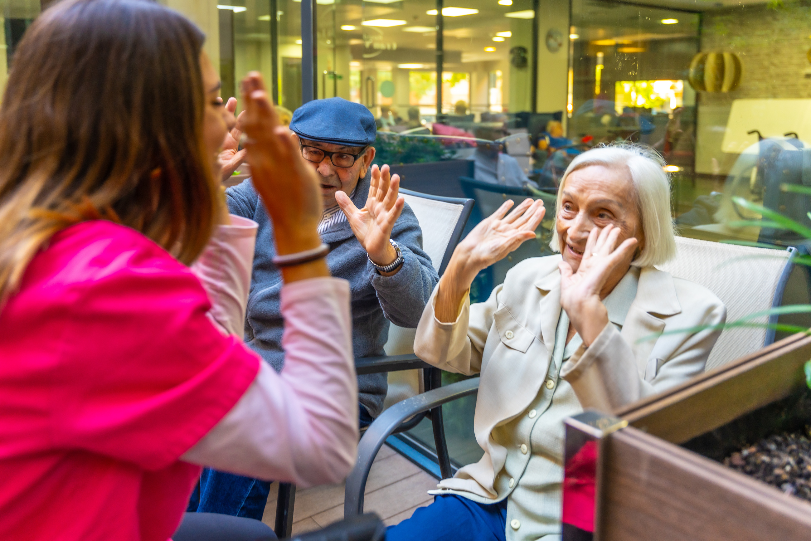 Nurse working on psychomotor skills with seniors in a geriatric